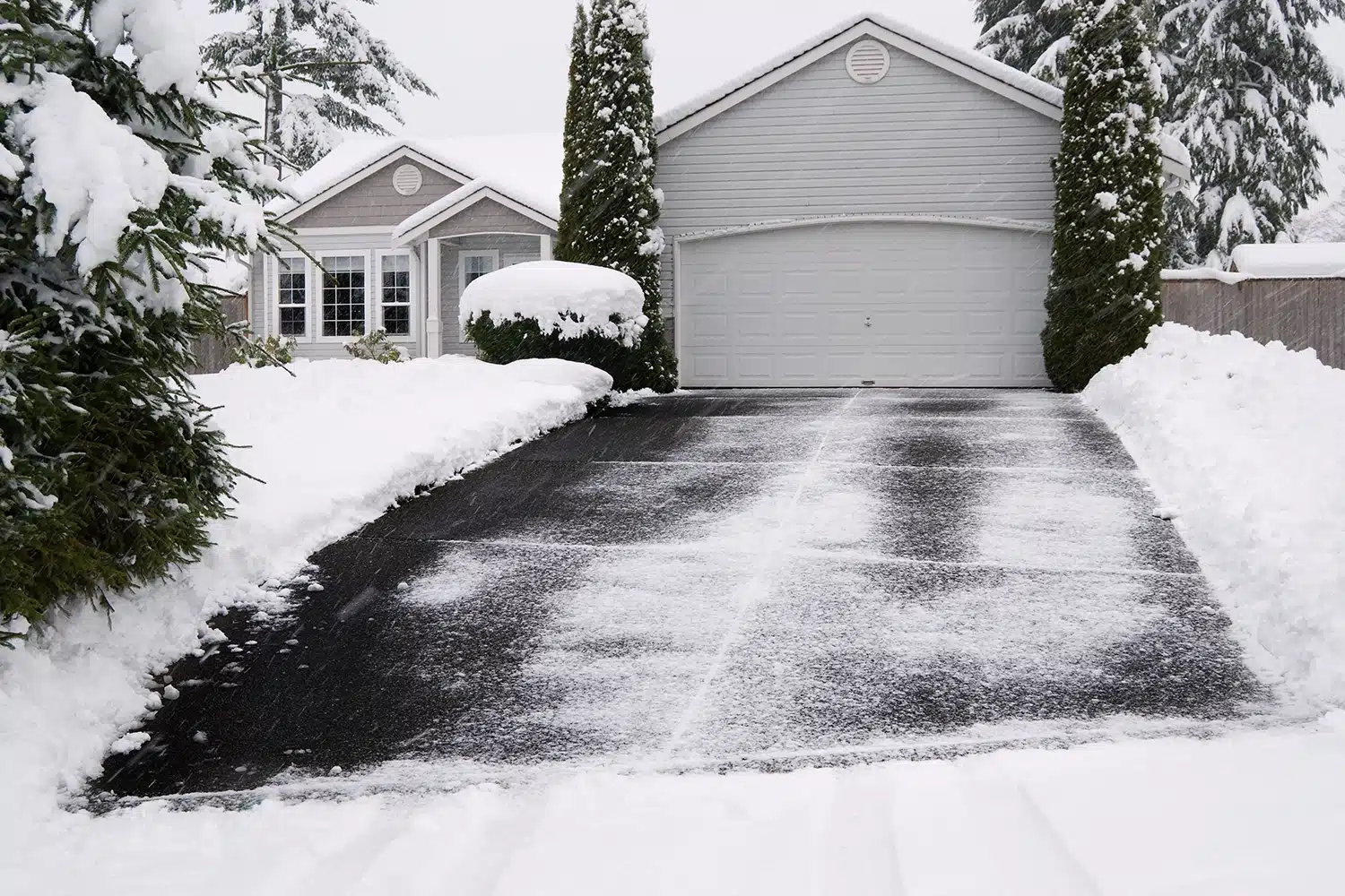 Residential heated driveway melting snow after a winter storm.