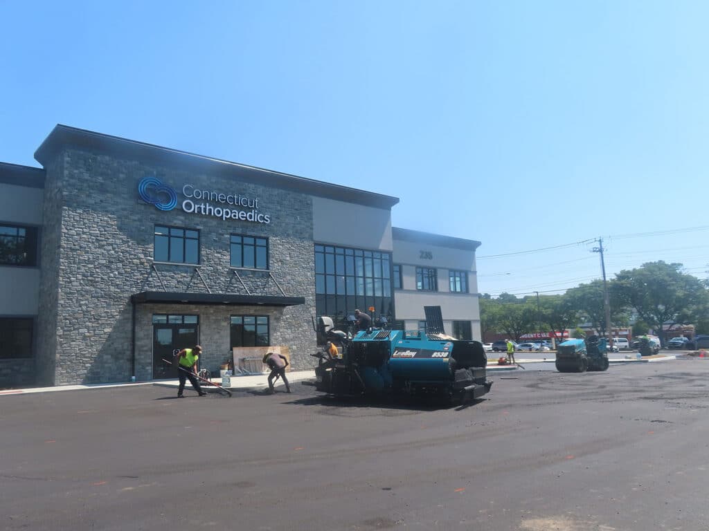 Commercial asphalt paving underway at a Connecticut Orthopaedics medical office building in Orange, Connecticut