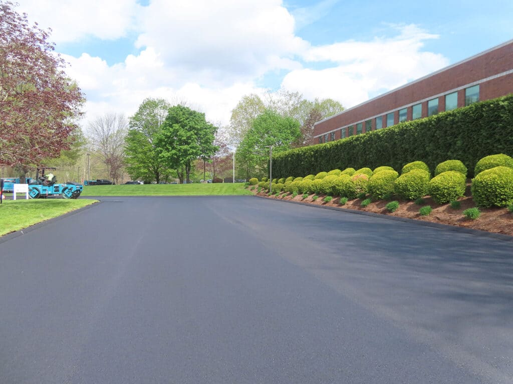 Commercial asphalt paving completed in Torrington, CT by Maisano Bros. Inc., featuring smooth new pavement at a commercial property.
